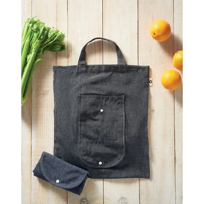 Geanta pliabila pentru cumparaturi din denim gri inchis cu buzunar frontal inchis cu capse albe si versiune compacta rulata