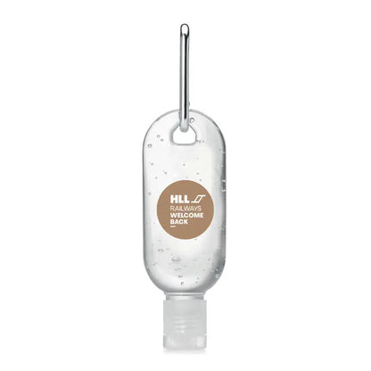 Gel de curatare maini 30 ml din plastic transparent cu clips metalic argintiu si eticheta maro hll railways welcome back
