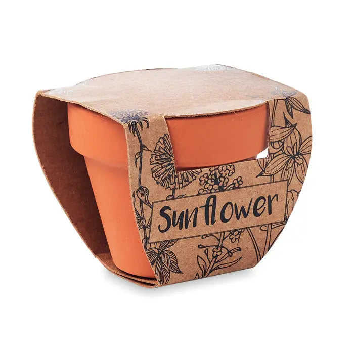 Ghiveci de teracota portocaliu cu model floarea-soarelui în mânecă maro cu imprimeu floral din carton