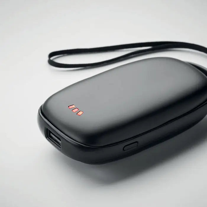 Incalzitor de maini power bank negru de 4000 mAh cu design rotunjit si trei leduri rosii pe suprafata superioara