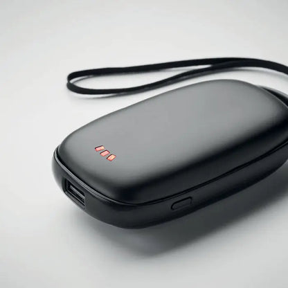Incalzitor de maini power bank negru de 4000 mAh cu design rotunjit si trei leduri rosii pe suprafata superioara