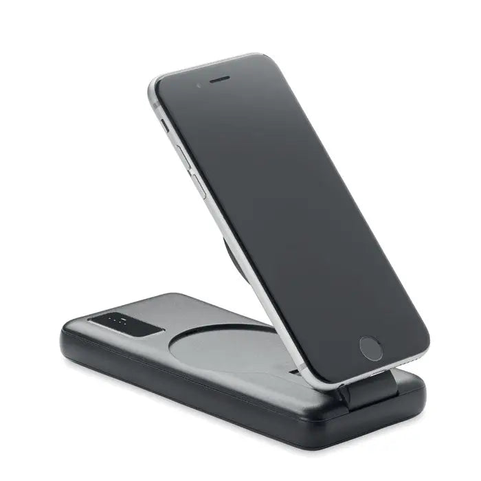 Smartphone negru odihnindu-se pe suport de incarcare magnetic wireless 15w cu buton circular integrat