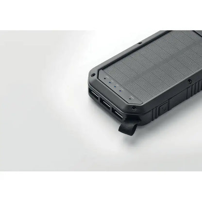Încărcător solar portabil negru 8000 mAh cu suprafață texturată și multiple porturi usb robust