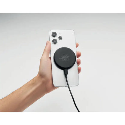 Încărcător wireless 3 în 1 negru rotund de 15w atașat pe spatele unui smartphone alb