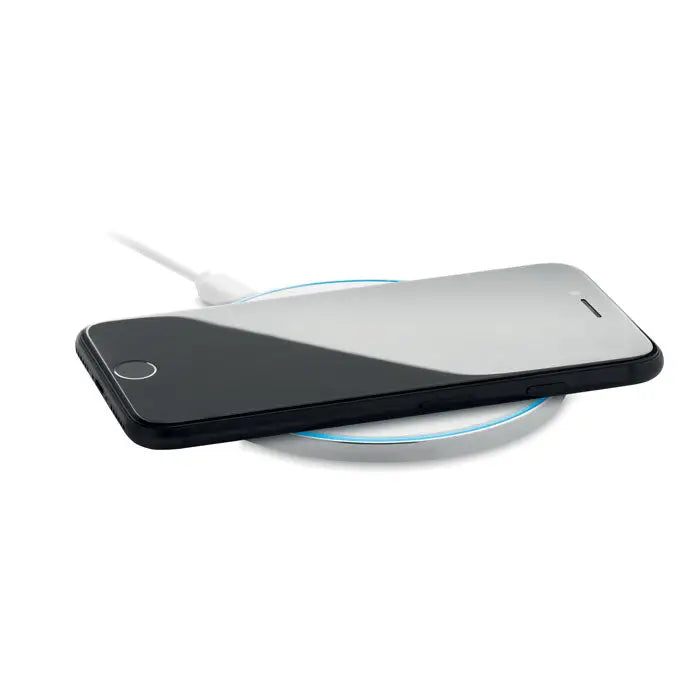 Incarcator wireless de sticla de 10w cu iphone negru si argintiu pe pad incarcare circular cu inel albastru luminos