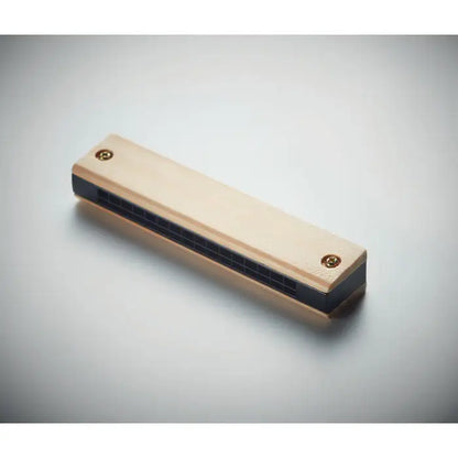 Muzicu?a light-colored wooden harmonica with black grille and brass screws for music playing