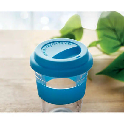 Pahar de sticla 350 ml cu capac si maner din silicon albastru pe cana transparenta pentru calatorii