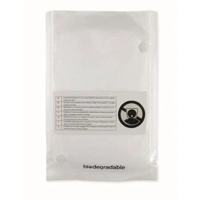 Clear plastic poncho and bag biodegradable with white label and multilingual instructions on the back side