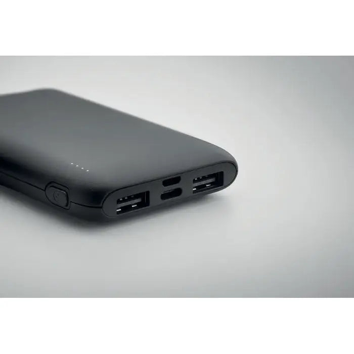 Power bank 5000 mah negru dreptunghiular cu multiple porturi usb și buton circular pe lateral