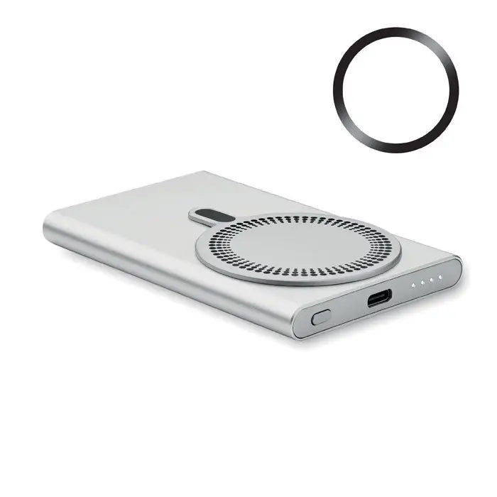 Power bank incarcator wireless de culoare argintie cu suprafata dreptunghiulara si pad de incarcare circular cu design perforat si port usb-c pe lateral