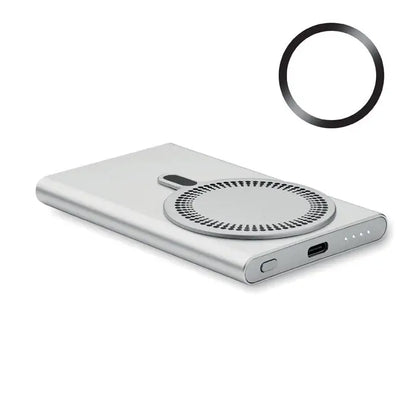 Power bank incarcator wireless de culoare argintie cu suprafata dreptunghiulara si pad de incarcare circular cu design perforat si port usb-c pe lateral