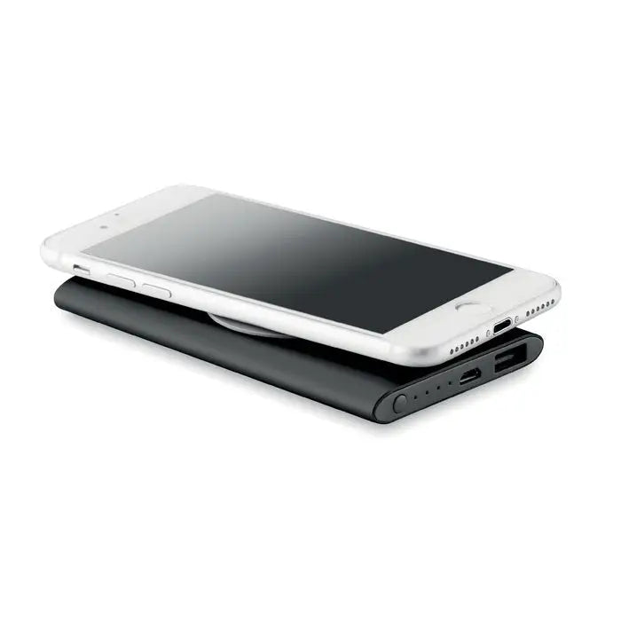 Power bank wireless 4000mah negru cu smartphone alb așezat deasupra pentru încărcare fără fir