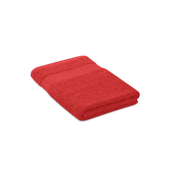 Prosop bumbac organic 140x70cm rosu vibrant, texturat moale de tip terry si margini pliabile uniform