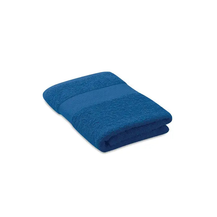 Prosop organic 50x30cm albastru inchis din bumbac terry cu textura moale si dungi orizontale subtile