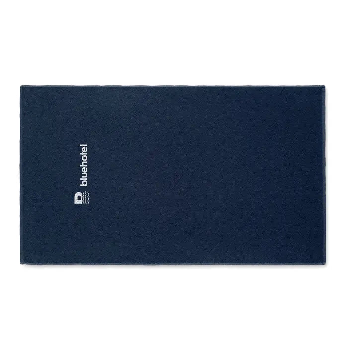 Prosop bleumarin din microfibra seaqual 100x170cm cu logo alb bluehotel si emblemă val în partea stângă
