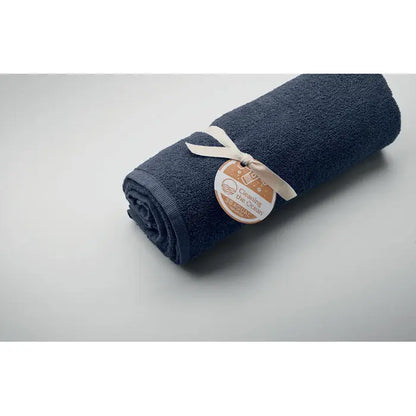 Prosop seaqual® albastru închis din material tip terry cloth moale, ruloul legat cu panglică crem