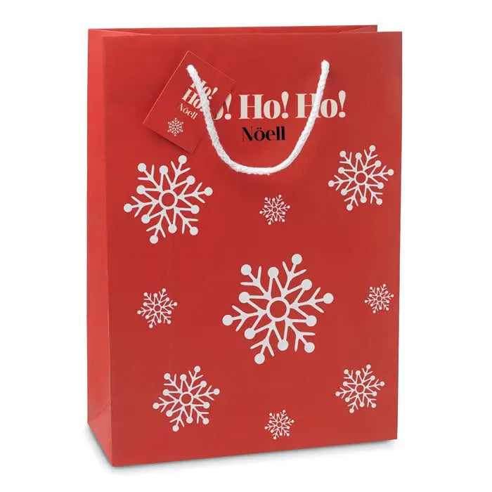 Punga de hartie cadou mare rosie cu modele albe de fulgi de nea si text ho ho ho cu maner alb asortat