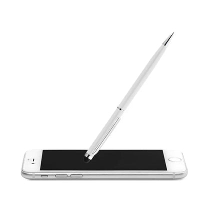 Rasuciti si atingeti pixul un stylus argintiu metalic cu varf negru asezat pe un smartphone alb