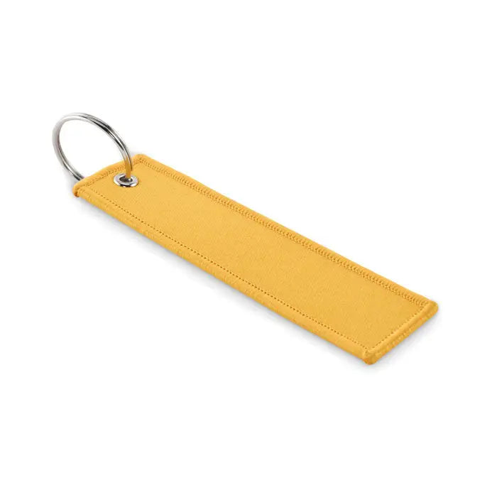 Scoateti inelul de chei inainte de zbor cheie cu breloc din material textil galben si inel metalic argintiu