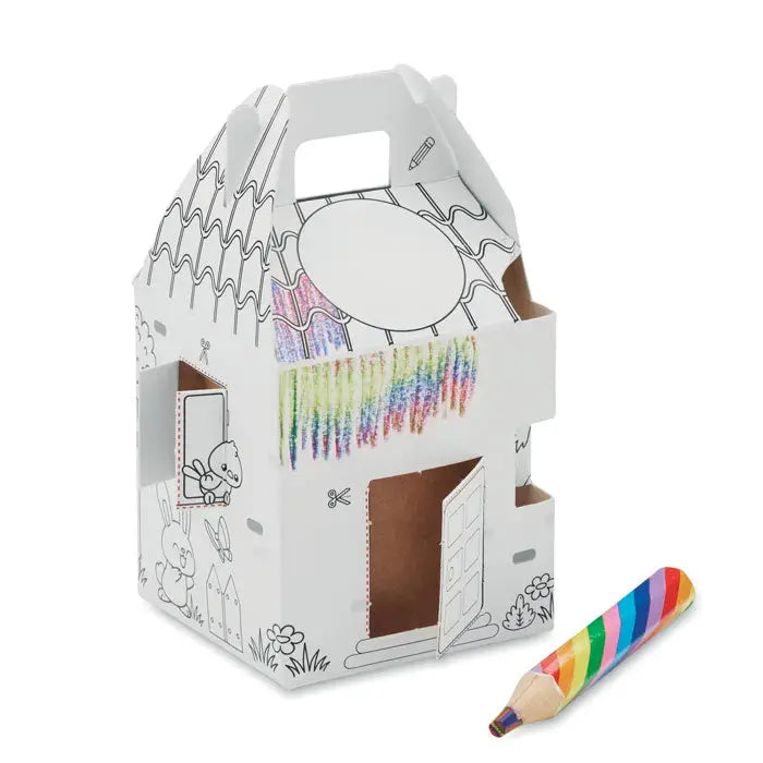 Casă de carton alb pentru colorat cu marcaje de creioane curcubeu și creion dungi colorate lângă semințe în formă de casă se cultivă