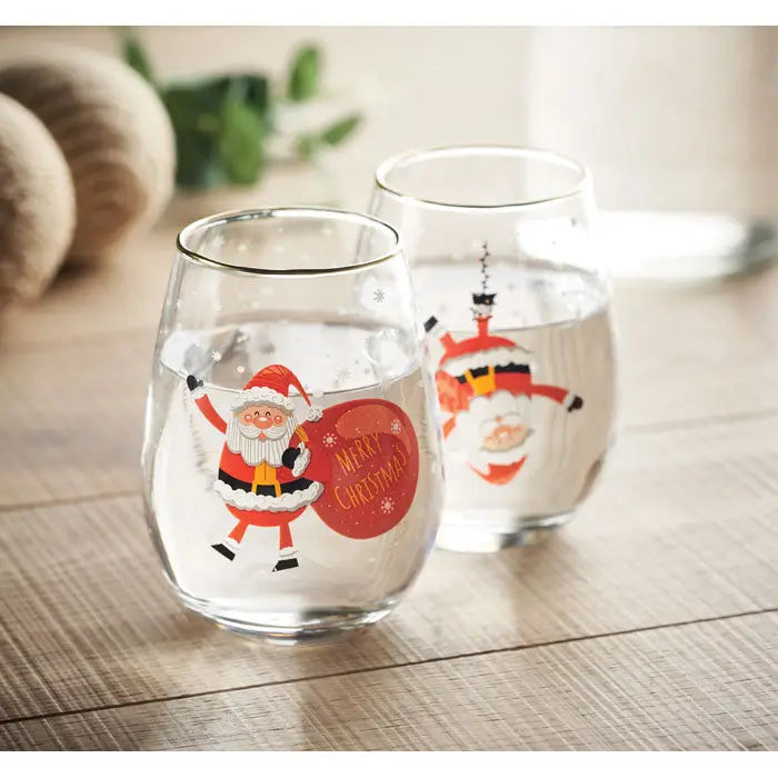 Set 2 pahare de craciun stemless din sticla clara cu ilustratii festive mos craciun si text merry christmas rosii cu bordura aurie