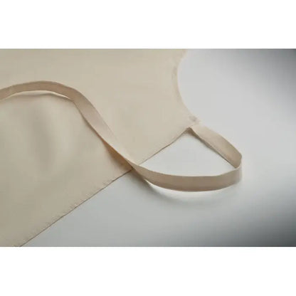 Sort din bumbac reciclat apron bej din bumbac cu design simplu si curele ajustabile