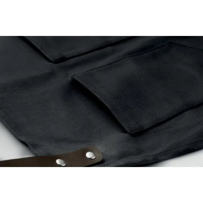 Sort din piele black canvas apron cu barete maro din piele si nituri argintii pentru protectie si durabilitate