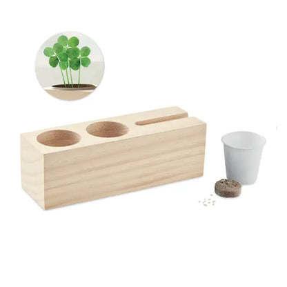 Suport de birou din lemn deschis cu kit de seminte si trei sloturi circulare pentru plantare si un slot mic pentru unelte