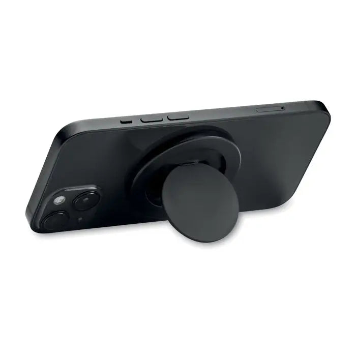 Suport magnetic pentru telefon negru din silicon montat pe spatele unui smartphone pentru prindere usoara