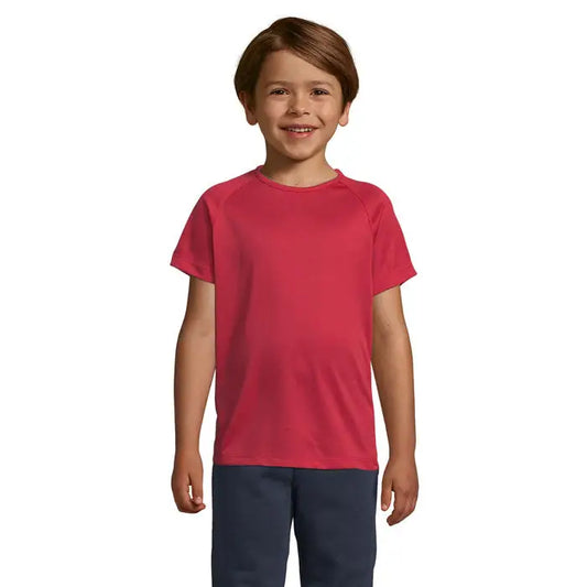 Copil purtând tricou roșu vibrant tricot sportiv pentru copii cu mâneci raglan din material 140g